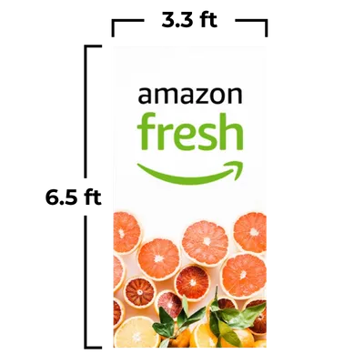 A vertical banner displays the 'Amazon Fresh' logo above a selection of vibrant citrus fruit slices, suggesting fresh produce availability.