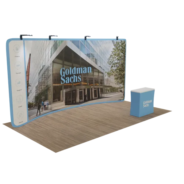 Curved exhibition display featuring Goldman Sachs building image, with a detached branded counter on a wood-style floor, presenting a corporate theme in an event setting.